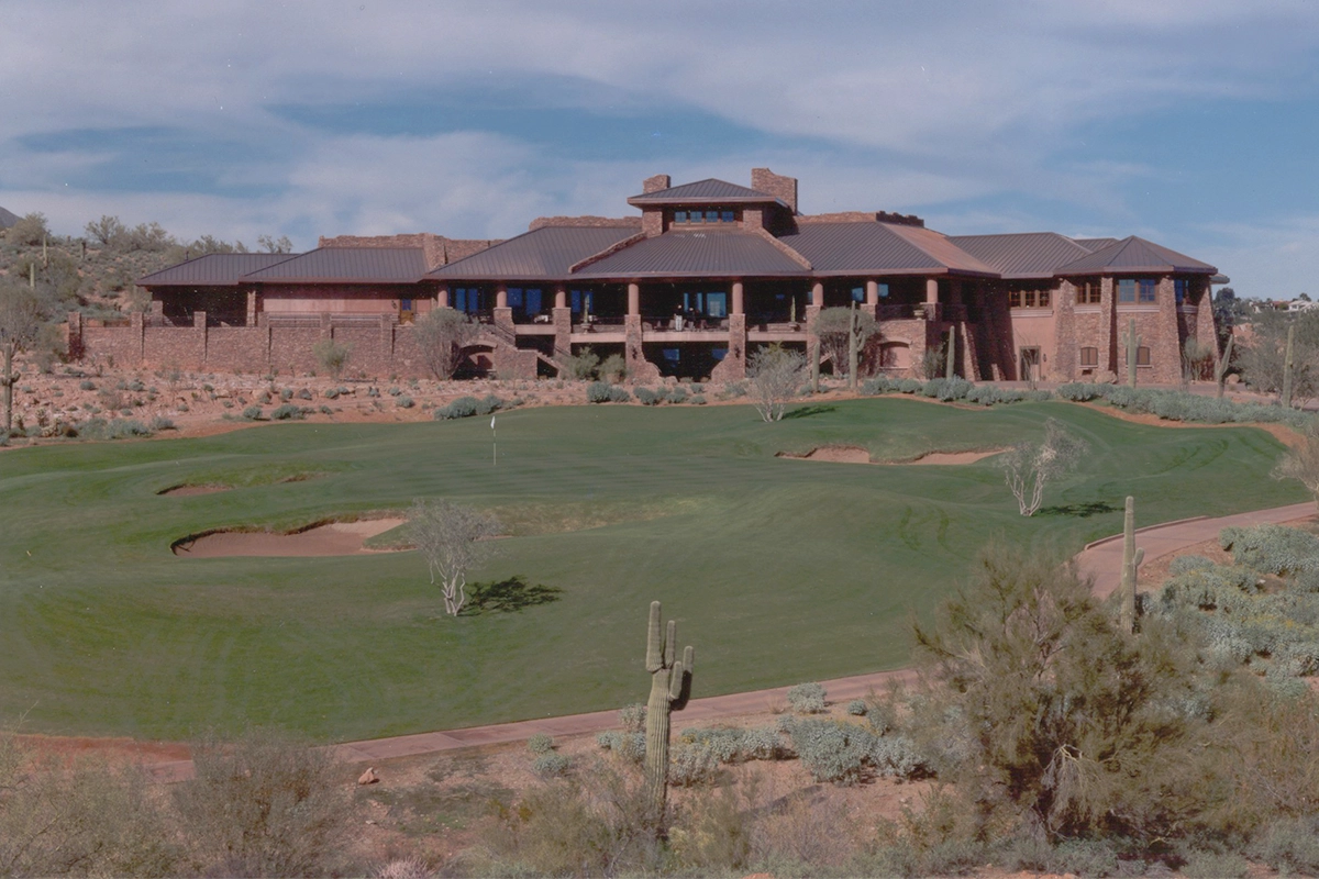 Fire Rock Country Club clubhouse exterior overlooking championship golf course with desert landscape and Southwestern architecture in Fountain Hills Arizona